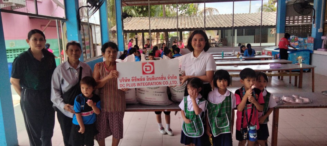 DC PLUS team donating rice to support student lunches